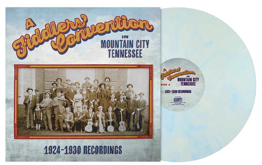 Vinyl record album cover and disc for 'A Fiddler's Convention in Mountain City Tennessee, 1924-1930 Recordings.' The cover shows a vintage group photograph and stylized orange title text, with a pale blue marbled record partially visible behind it.